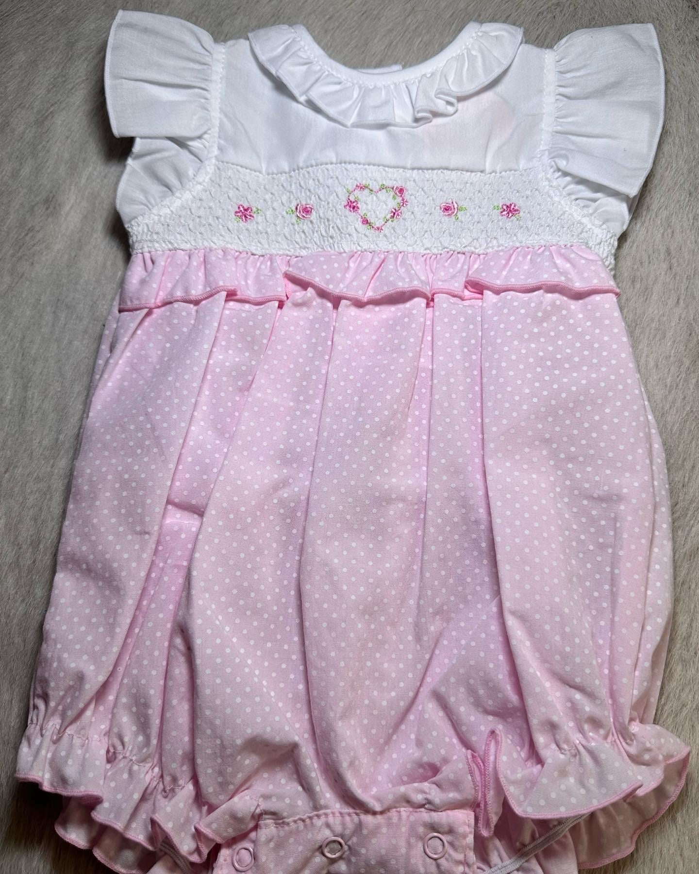 Pink/white floral romper 0-9m